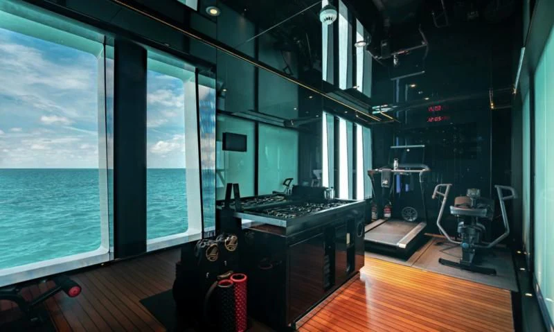 a room with a large screen aboard SEALION Yacht for Sale