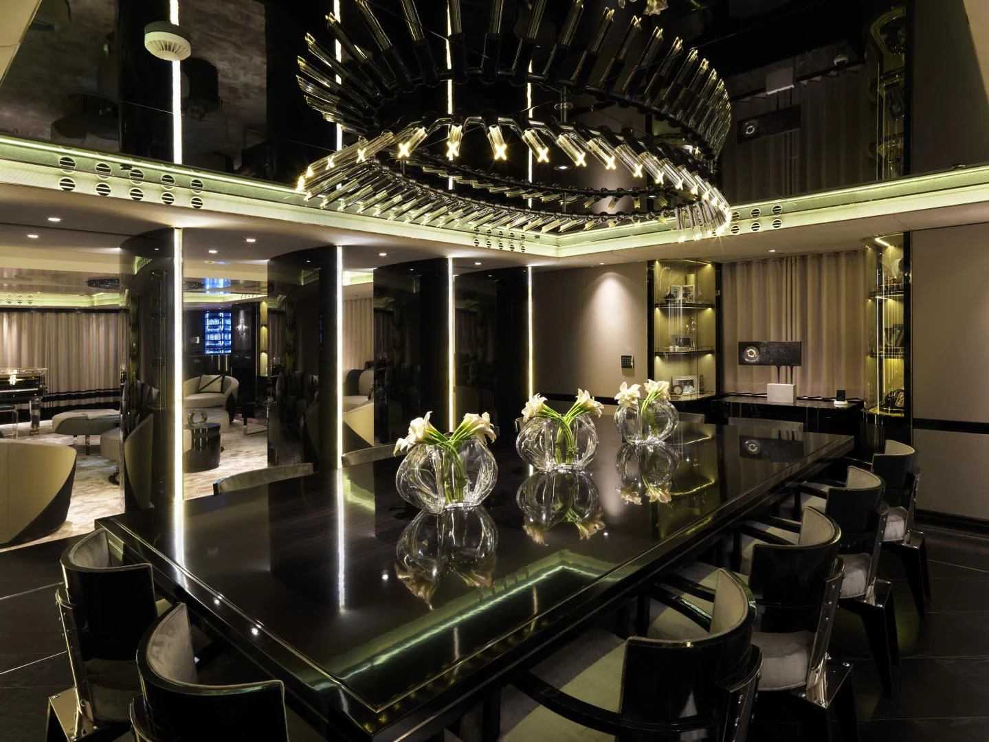 a room with tables and chairs aboard SEALION Yacht for Sale