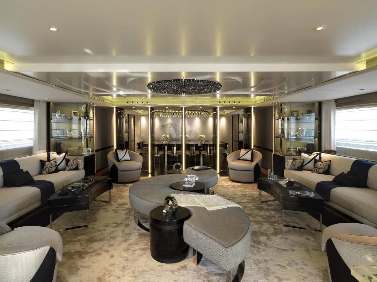 a large living room with a large glass wall aboard SEALION Yacht for Sale