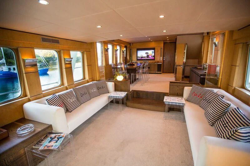 a living room with a large window aboard DALI Yacht for Sale