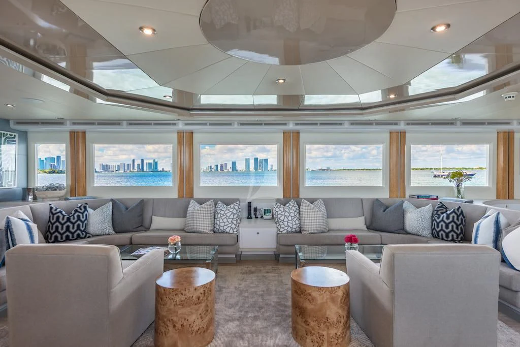 a living room with a large sofa aboard SURINA Yacht for Sale