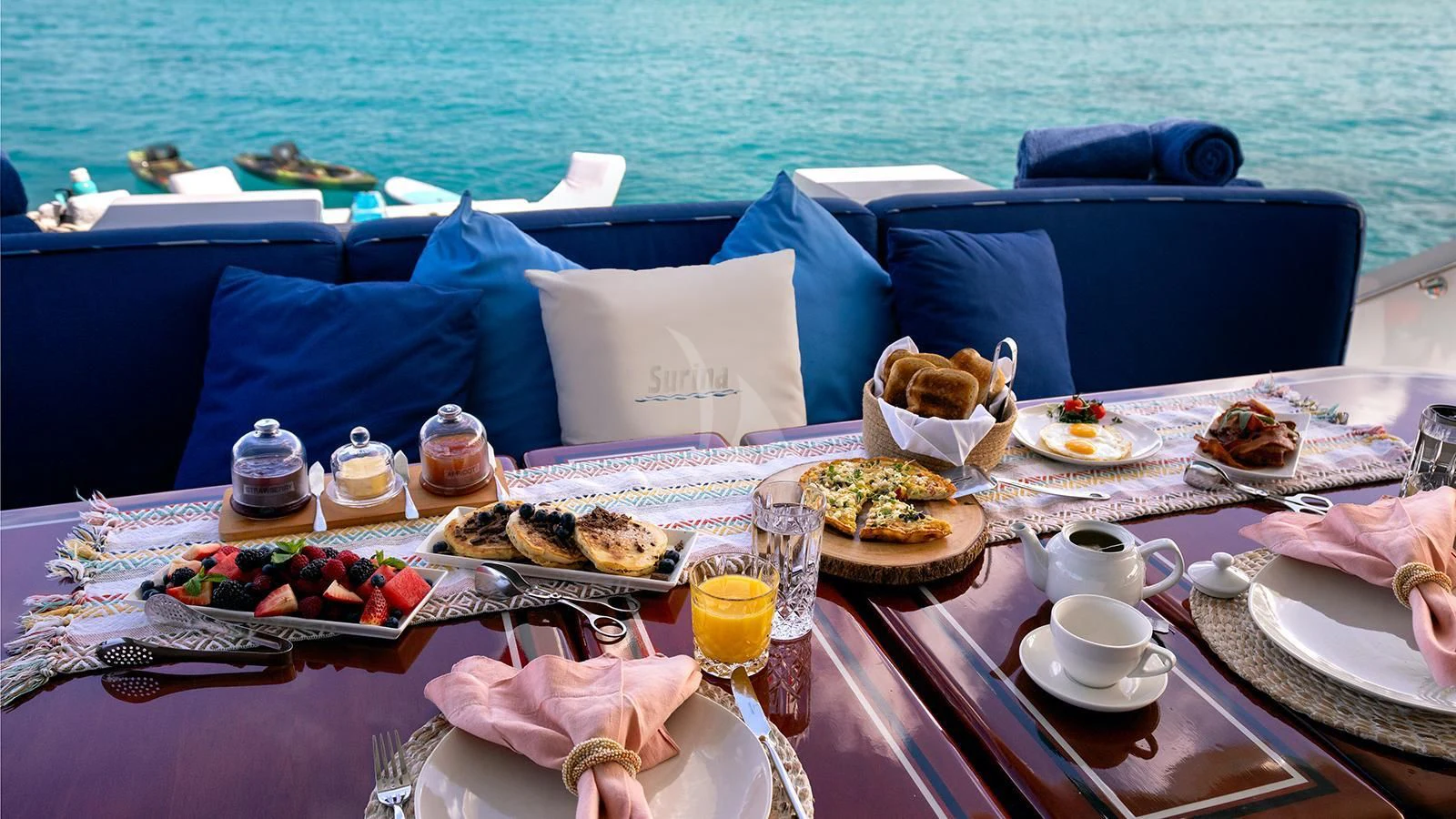a table with food and drinks on it aboard SURINA Yacht for Sale