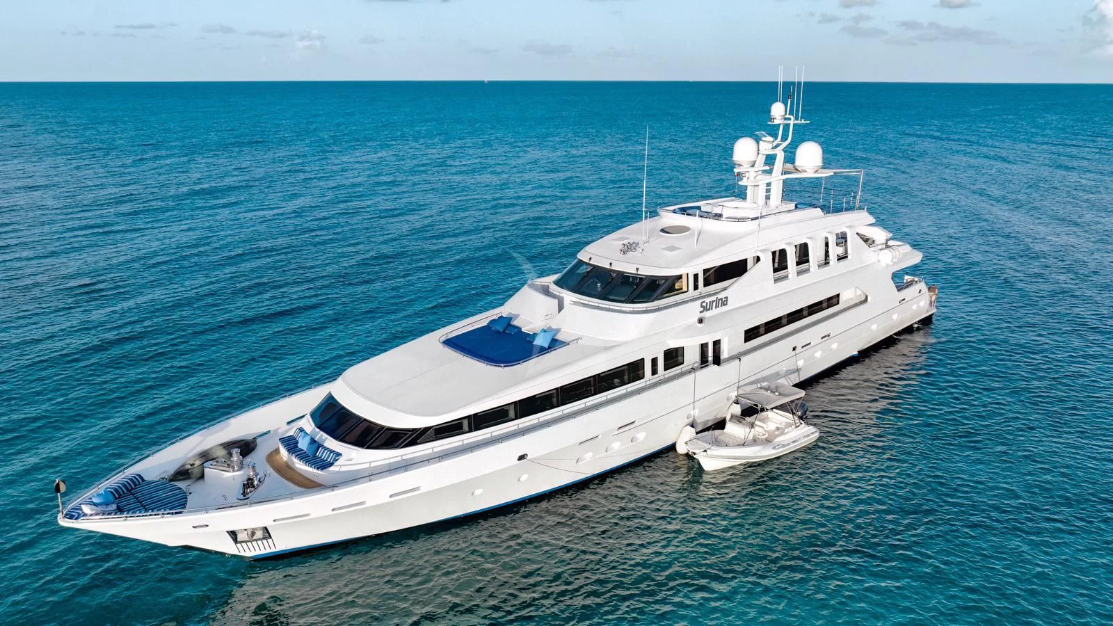 a large white yacht in the water aboard SURINA Yacht for Sale