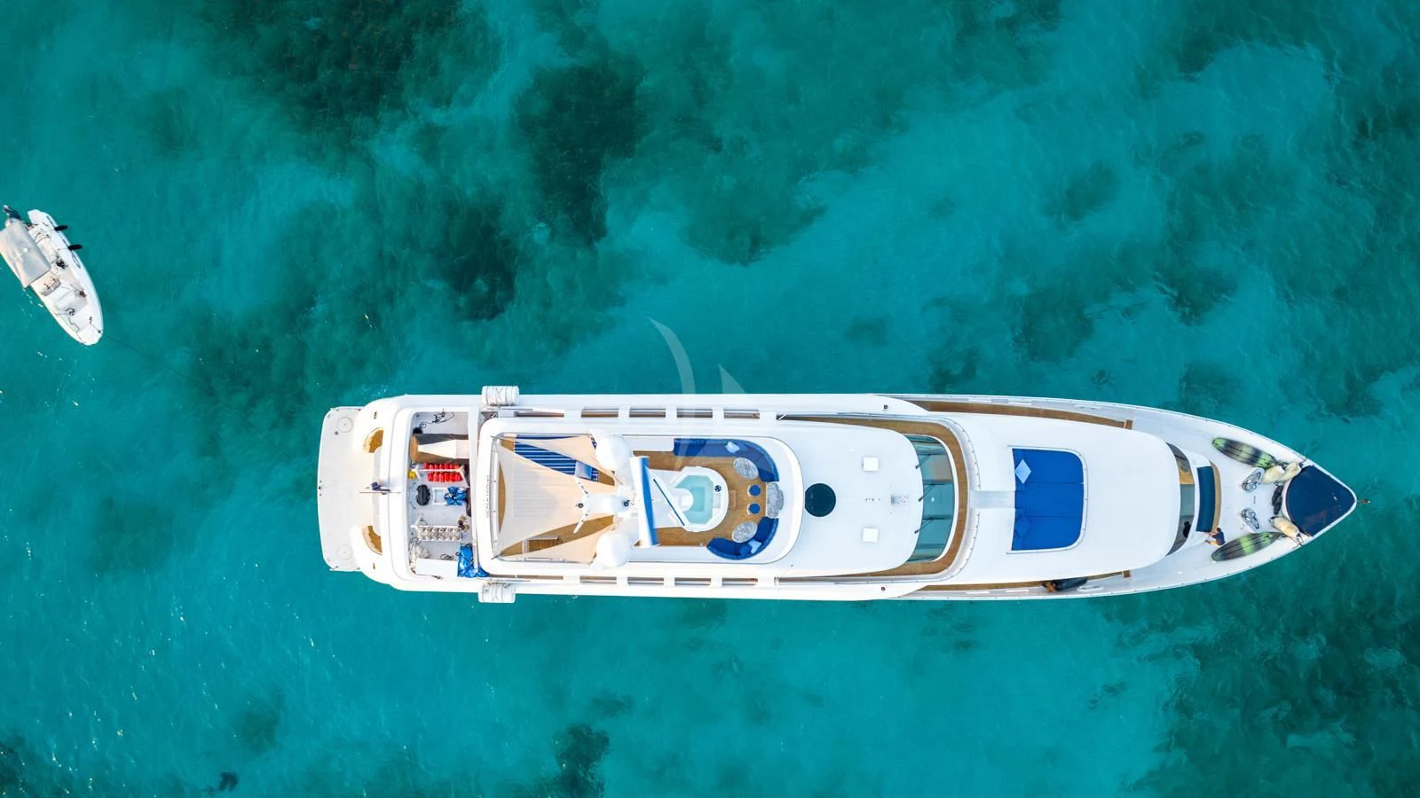 a white helicopter in the sky aboard SURINA Yacht for Sale