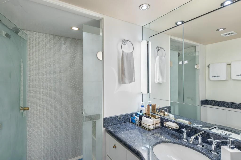 a bathroom with a large mirror aboard SURINA Yacht for Sale