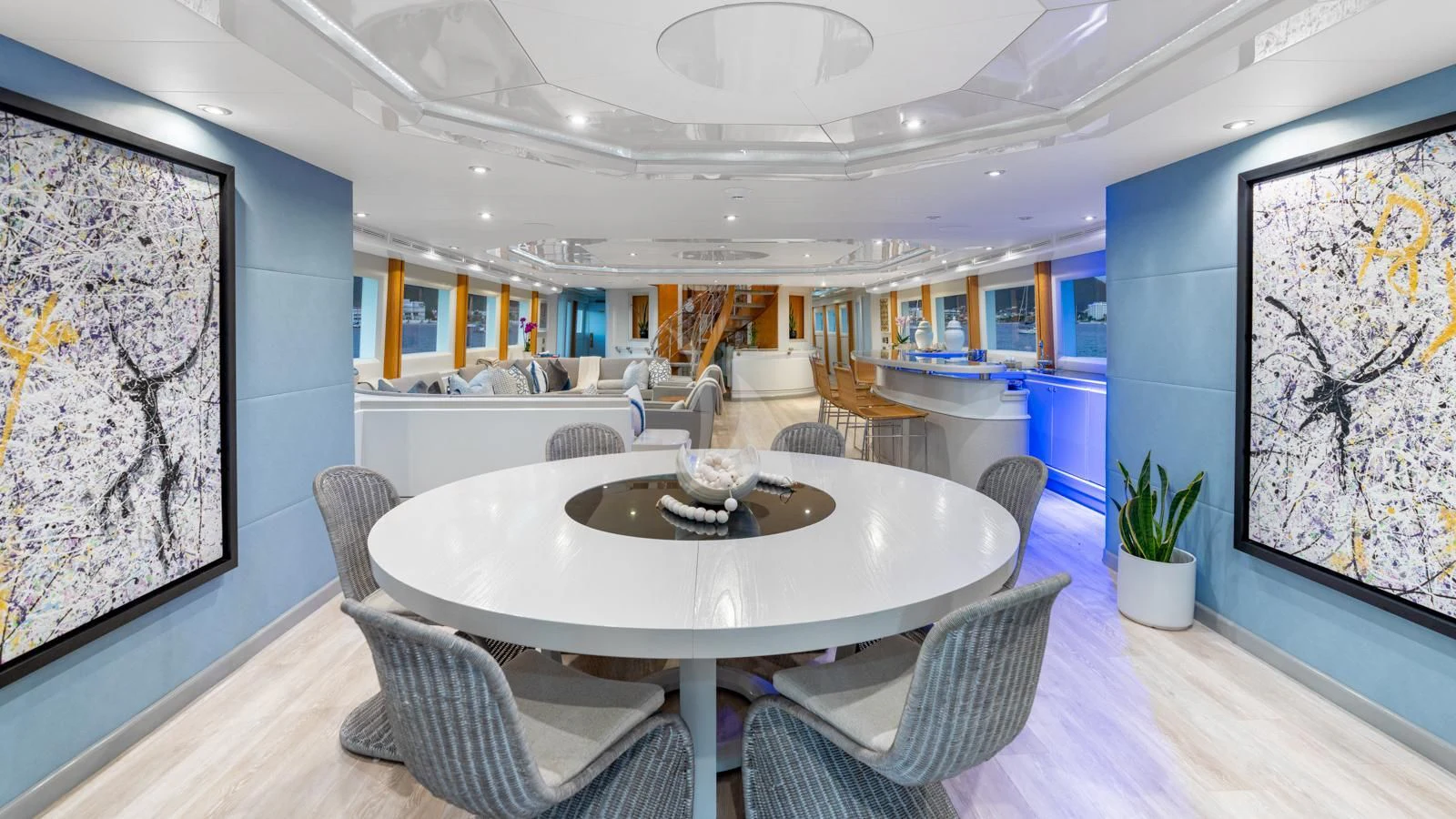 a large dining table in a large room aboard SURINA Yacht for Sale