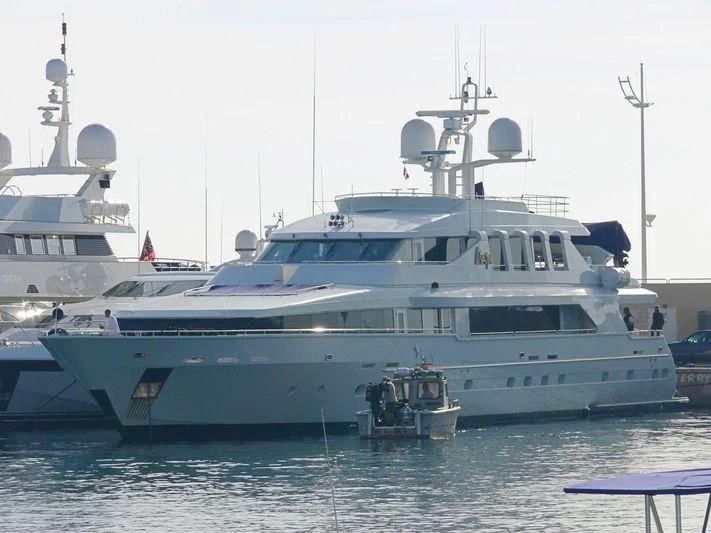 a large white boat with a smaller boat on it aboard SURINA Yacht for Sale