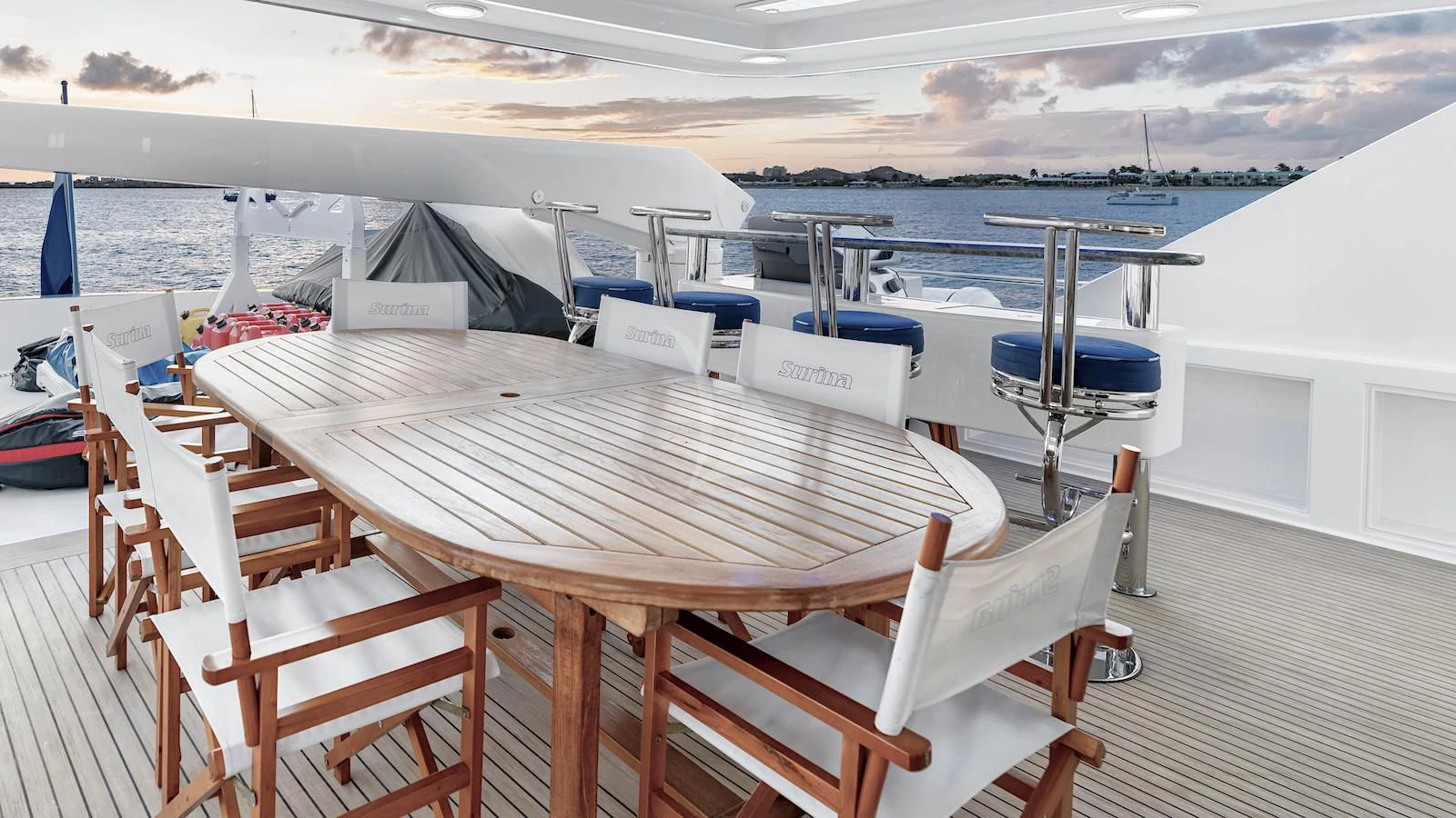 a deck with chairs and tables on it aboard SURINA Yacht for Sale
