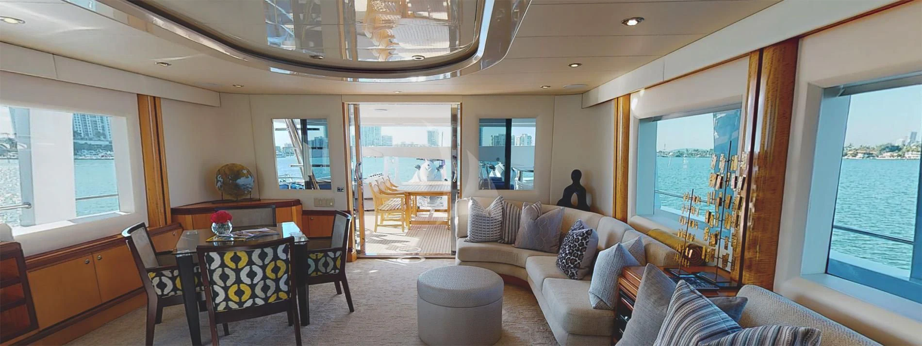 a living room with a large window aboard SURINA Yacht for Sale