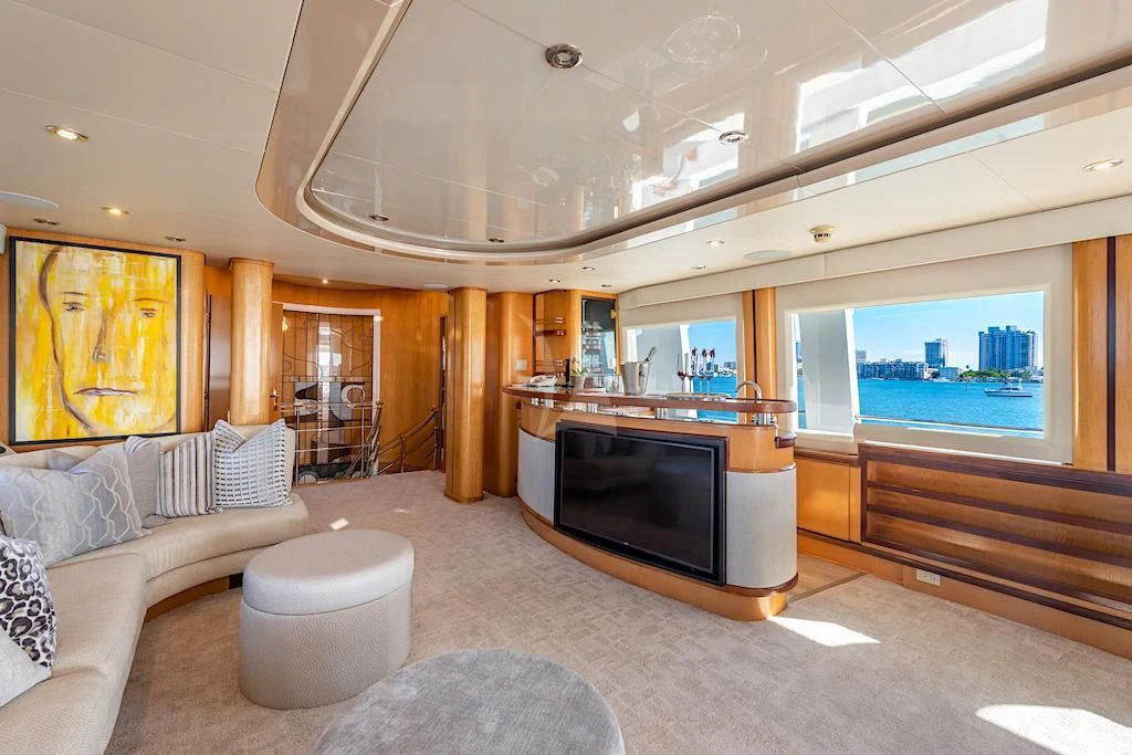 a living room with a large tv aboard SURINA Yacht for Sale