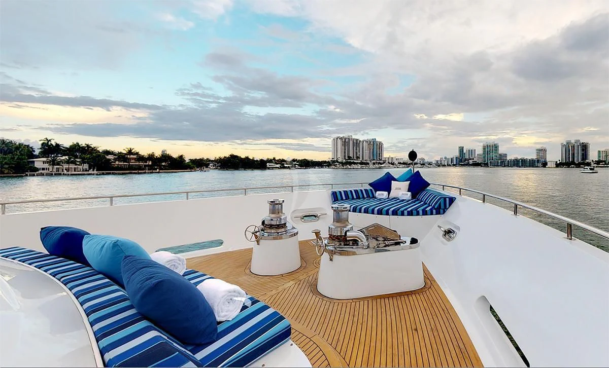 a deck with a view of a city and water aboard SURINA Yacht for Sale