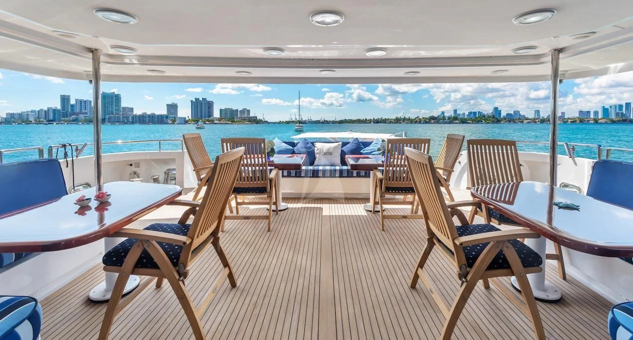 a room with a table and chairs aboard SURINA Yacht for Sale