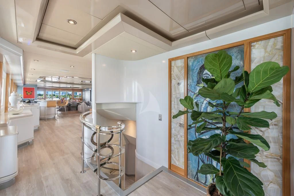 a large room with a plant in it aboard SURINA Yacht for Sale