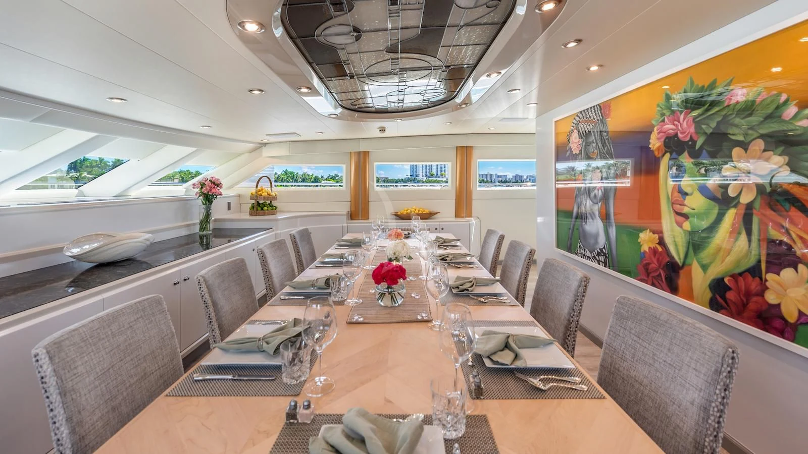 a large dining room with a large table and chairs aboard SURINA Yacht for Sale