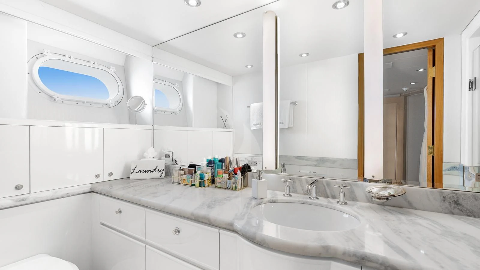 a bathroom with a sink and a mirror aboard SURINA Yacht for Sale