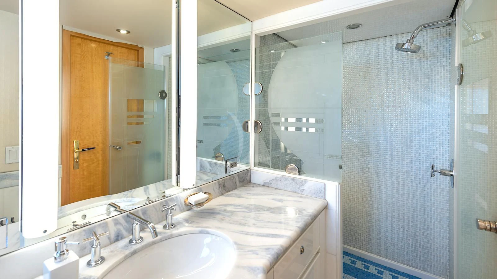 a bathroom with a large mirror aboard SURINA Yacht for Sale
