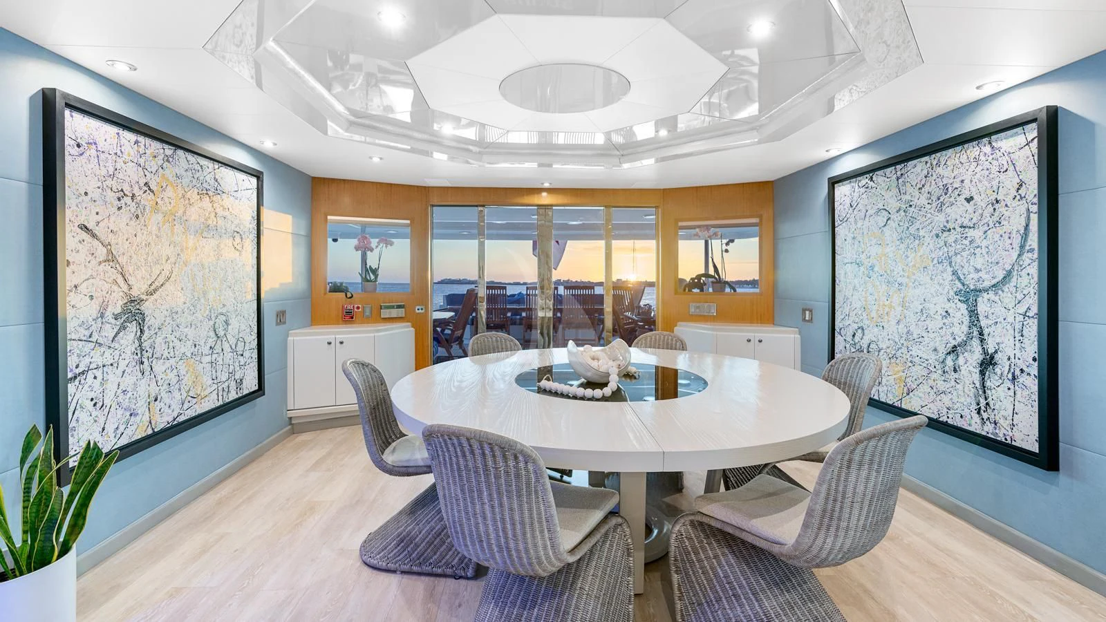 a large dining room with a large map on the wall aboard SURINA Yacht for Sale