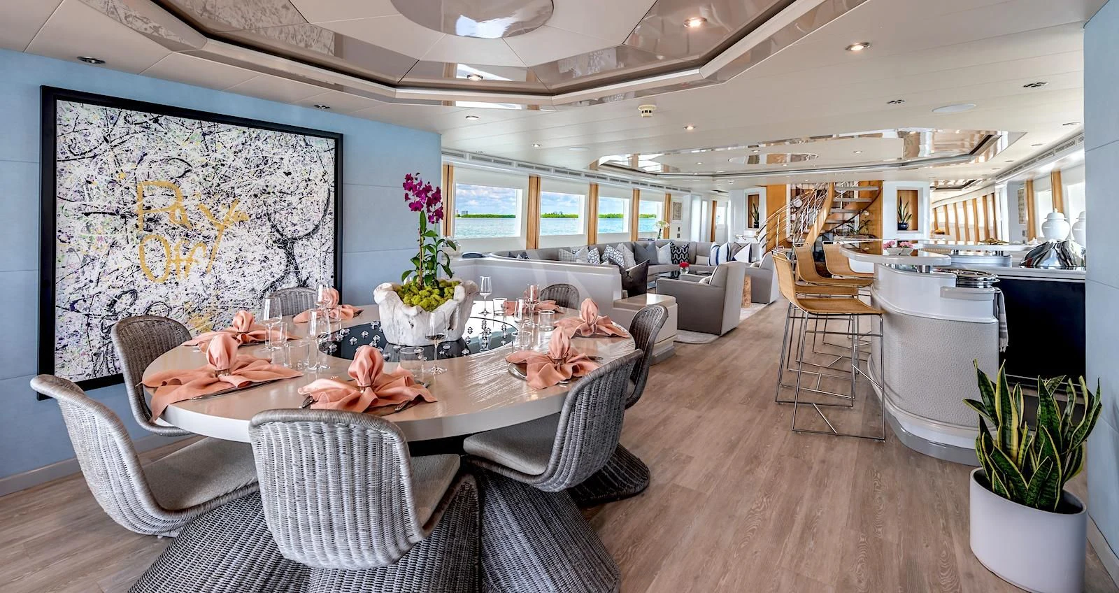 a large dining room with a large table and chairs aboard SURINA Yacht for Sale
