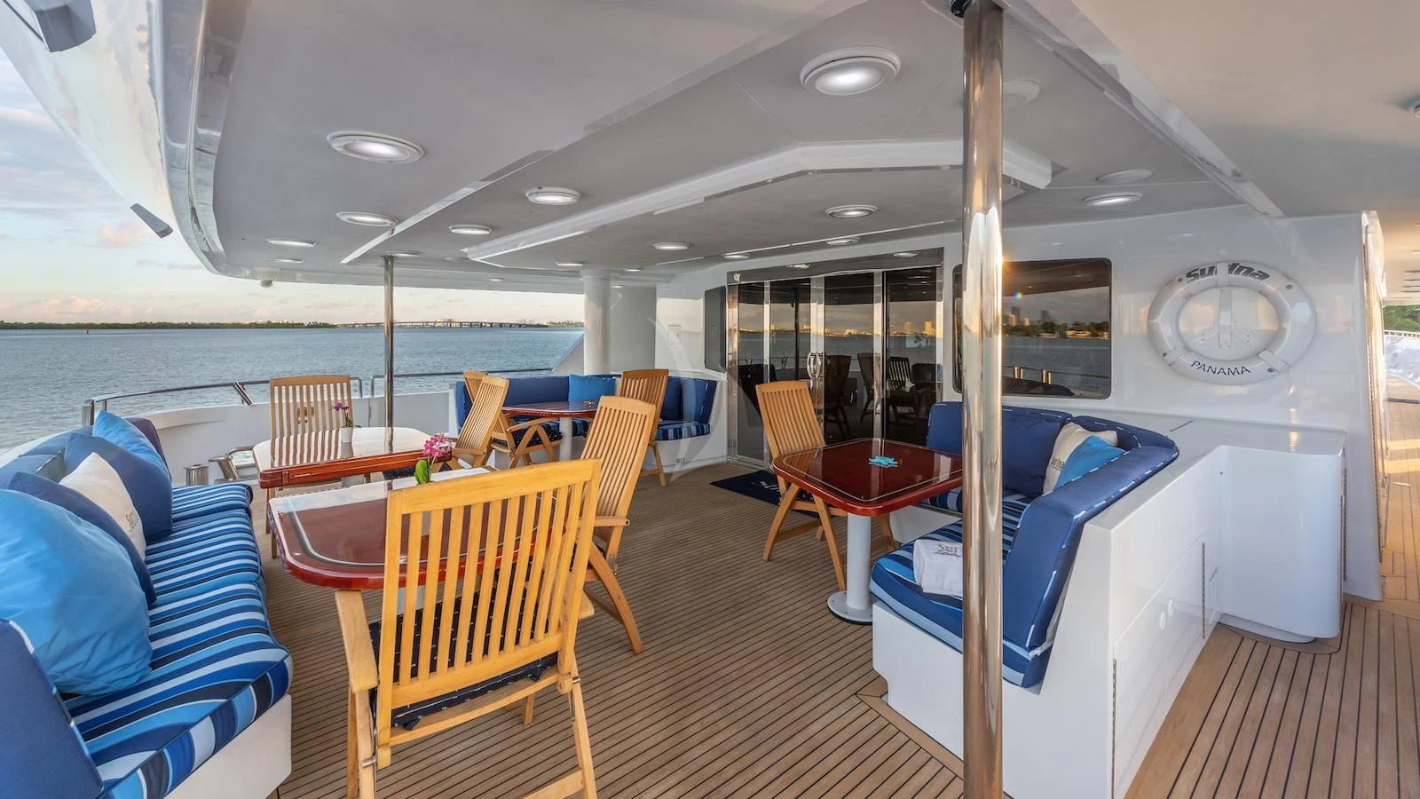 a boat with chairs and tables aboard SURINA Yacht for Sale