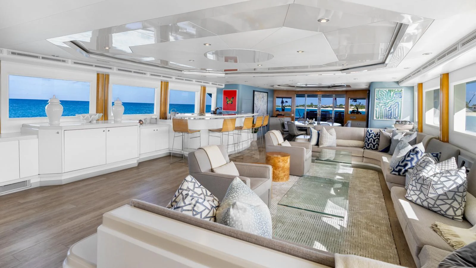 a large living room with a large screen aboard SURINA Yacht for Sale