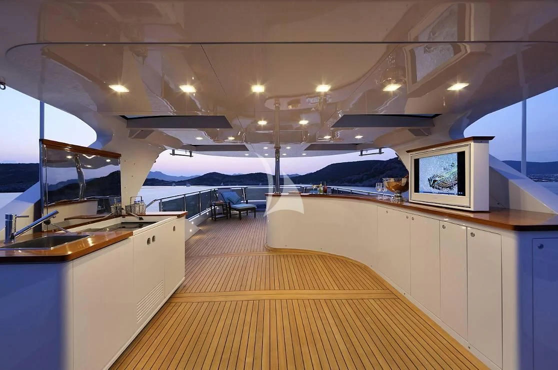 a large kitchen with a large screen aboard EGO Yacht for Sale