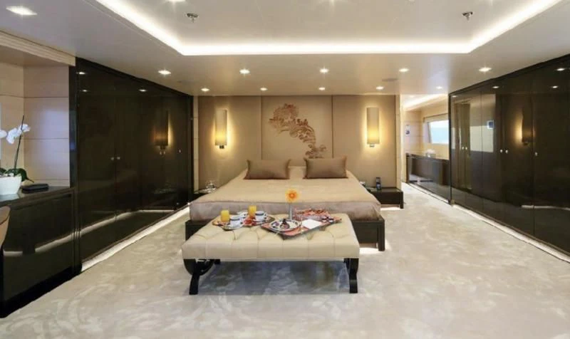 a large bedroom with a large bed aboard EGO Yacht for Sale