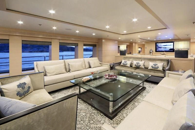 a living room with a large window aboard EGO Yacht for Sale