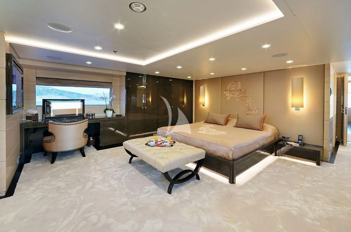 a bedroom with a bed and a tv aboard EGO Yacht for Sale