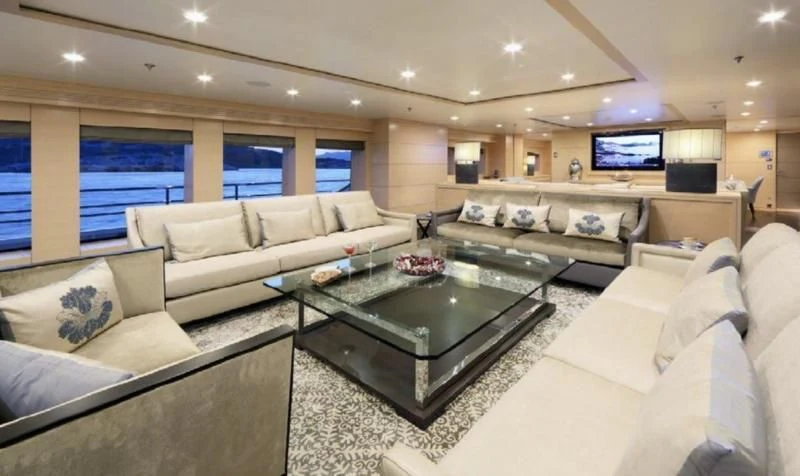 a living room with a large window aboard EGO Yacht for Sale