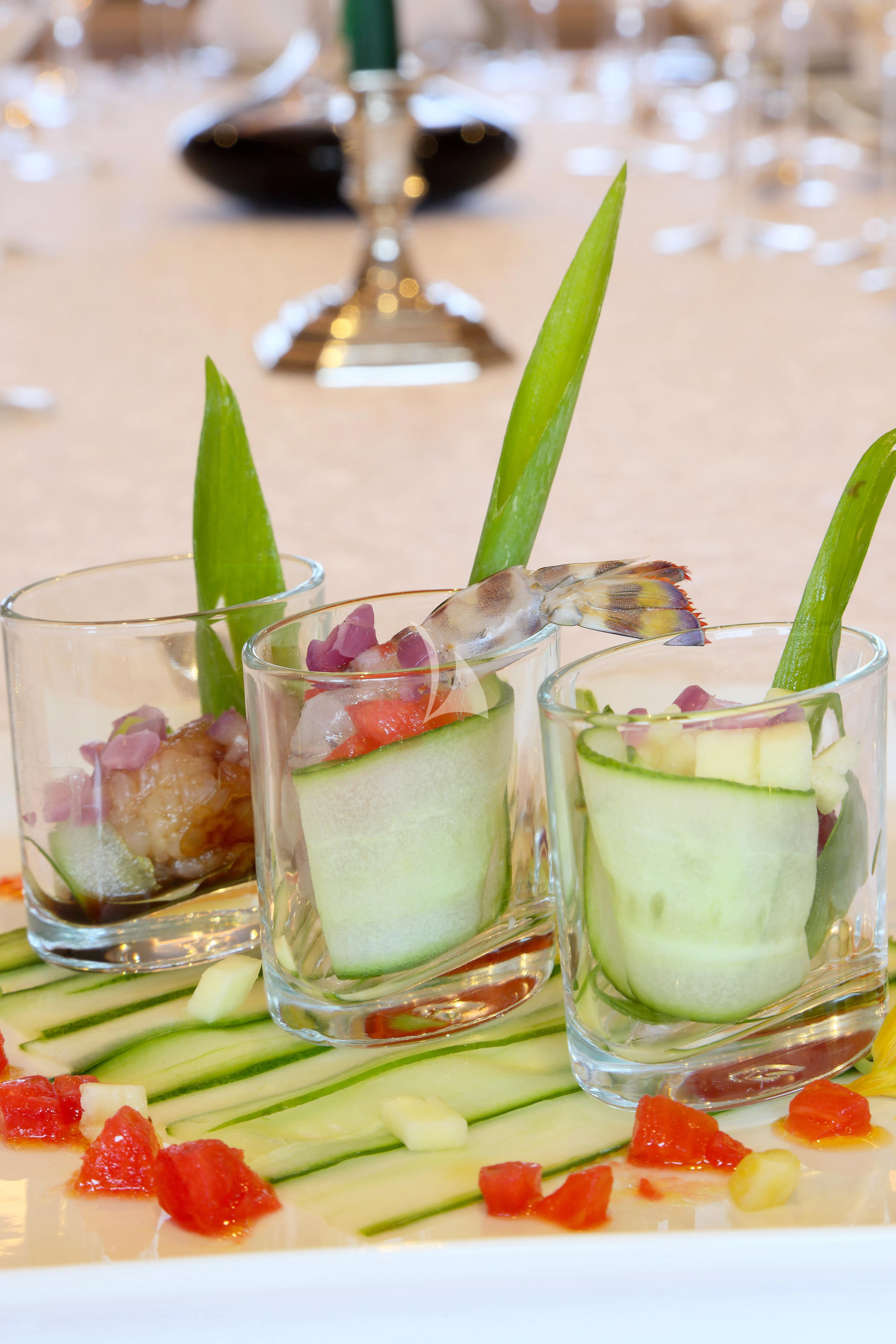 a group of glasses with different colored liquid in them aboard EGO Yacht for Sale