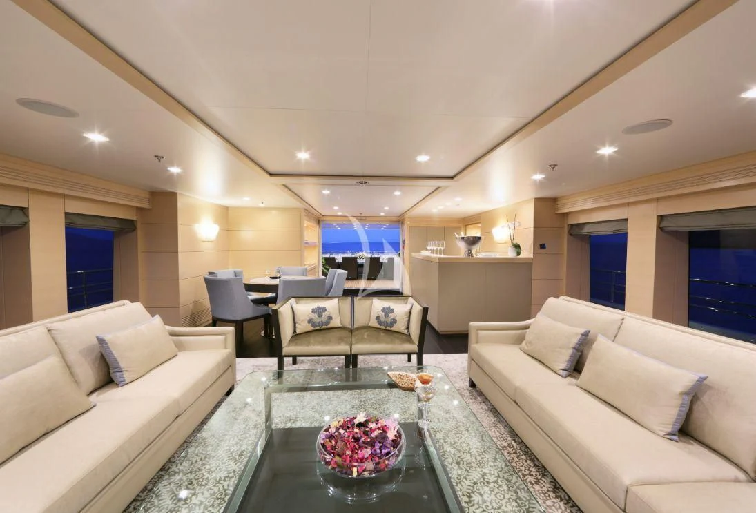 a living room with a couch and a coffee table aboard EGO Yacht for Sale