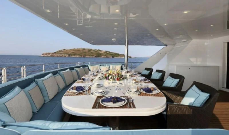 a dining table on a boat aboard EGO Yacht for Sale