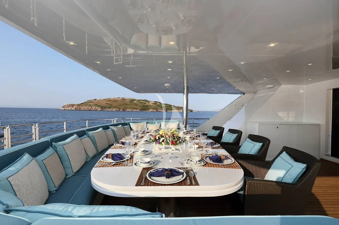 a dining table on a boat aboard EGO Yacht for Sale