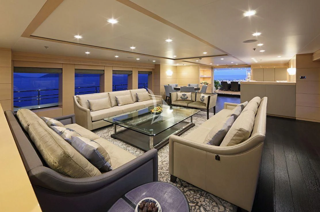 a living room with a couch and a table aboard EGO Yacht for Sale