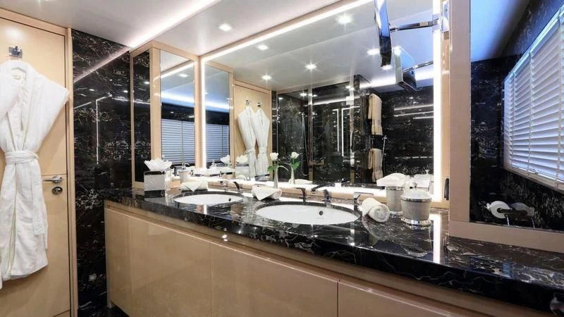 a bathroom with a large mirror aboard EGO Yacht for Sale