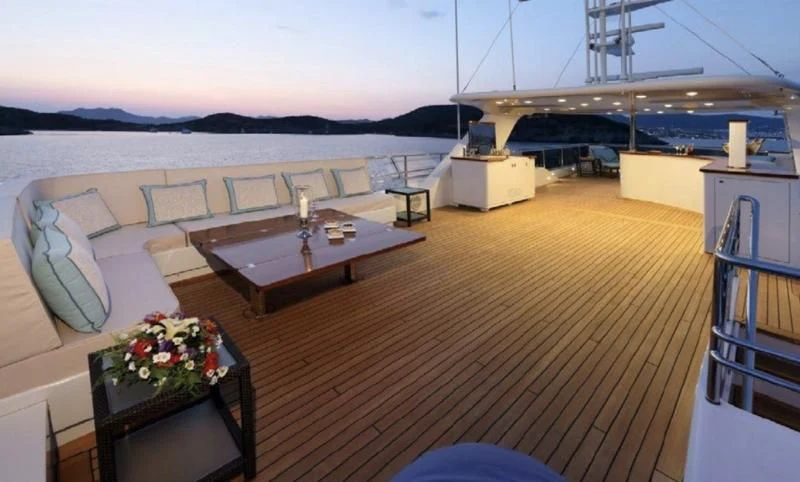 a room with a table and chairs aboard EGO Yacht for Sale