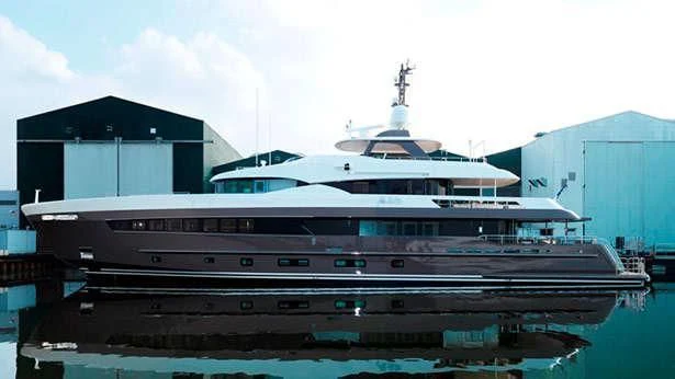 a large cruise ship docked aboard ARES Yacht for Sale