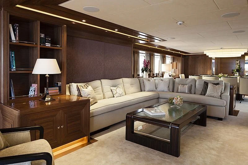 a living room with a couch and a coffee table aboard ARES Yacht for Sale