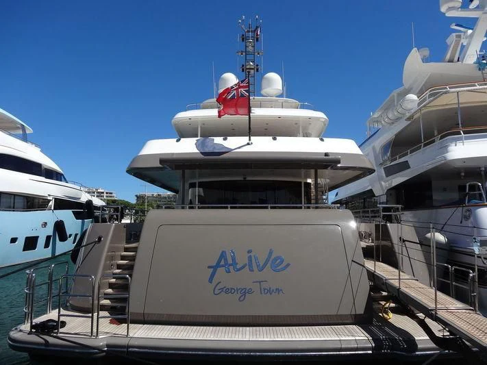 a large white ship docked aboard ARES Yacht for Sale