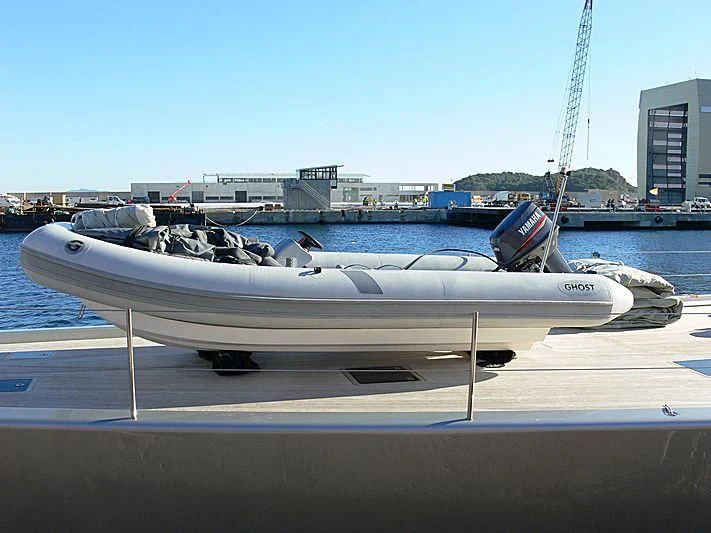 a white boat on a dock aboard GHOST Yacht for Sale