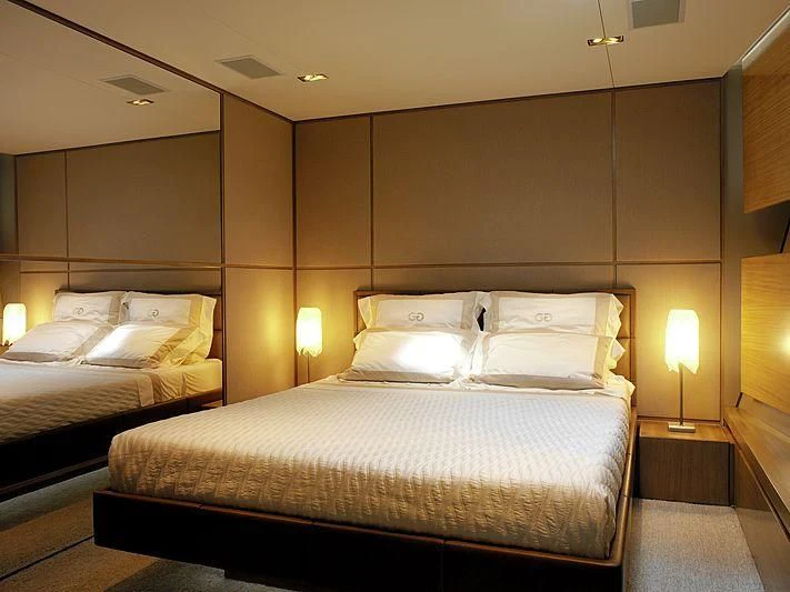 a couple of beds in a hotel room aboard GHOST Yacht for Sale