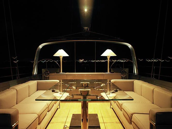 a room with a table and chairs aboard GHOST Yacht for Sale