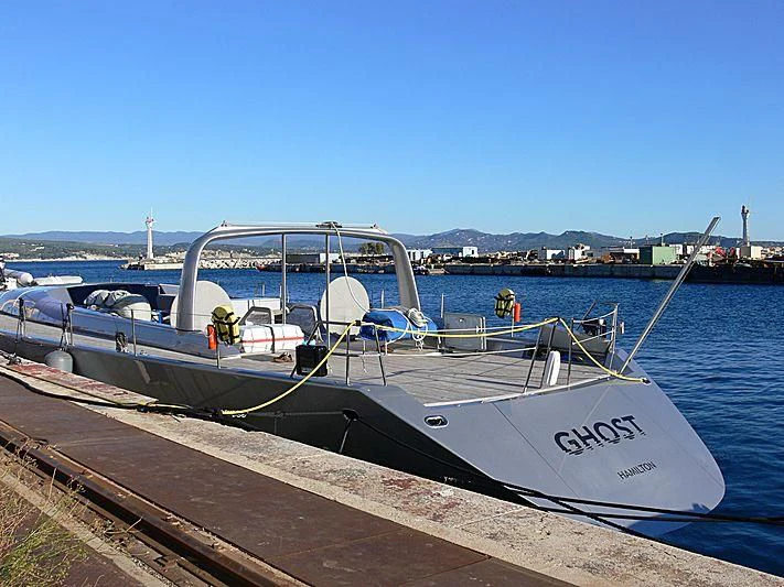 a boat docked at a pier aboard GHOST Yacht for Sale