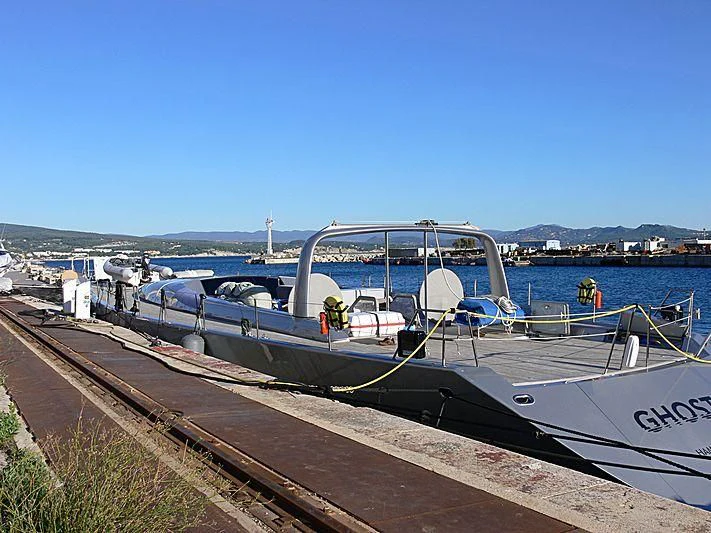 a boat docked at a pier aboard GHOST Yacht for Sale