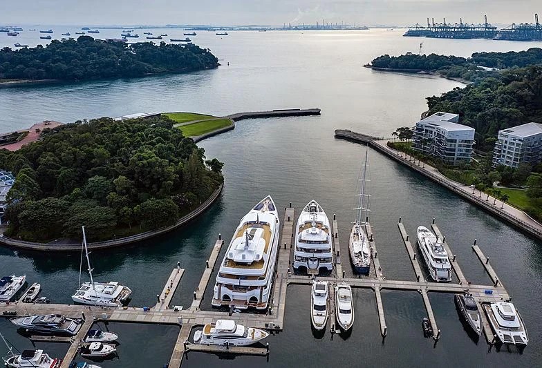 a body of water with boats and buildings along it aboard WHITE RABBIT Yacht for Sale