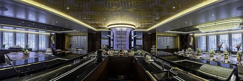 a large room with a large table and chairs aboard WHITE RABBIT Yacht for Sale