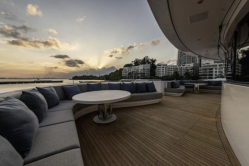 a living room with a couch and a table aboard WHITE RABBIT Yacht for Sale