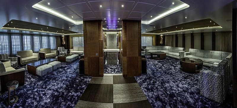 a large room with couches and a table aboard WHITE RABBIT Yacht for Sale
