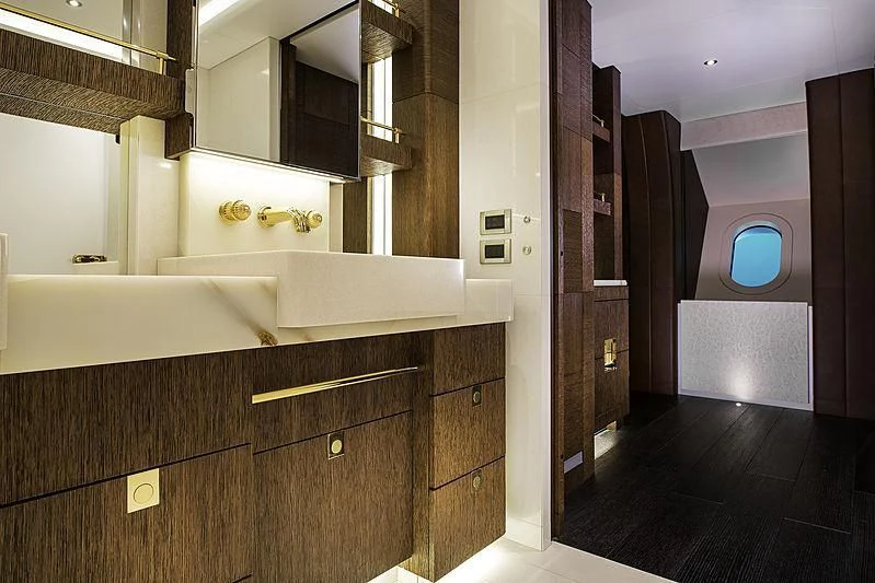 a bathroom with a large mirror aboard WHITE RABBIT Yacht for Sale