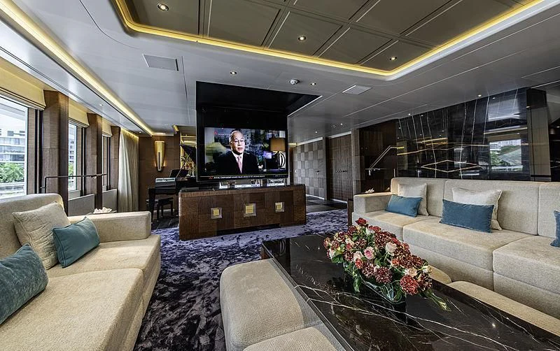 a living room with a large television aboard WHITE RABBIT Yacht for Sale